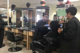 Cosmetology Teacher Carla Matthews teaches her students how to properly perform styling treatments according to state board on Thursday, November 2, 2017. (Georgia Slater/Capital News Service)