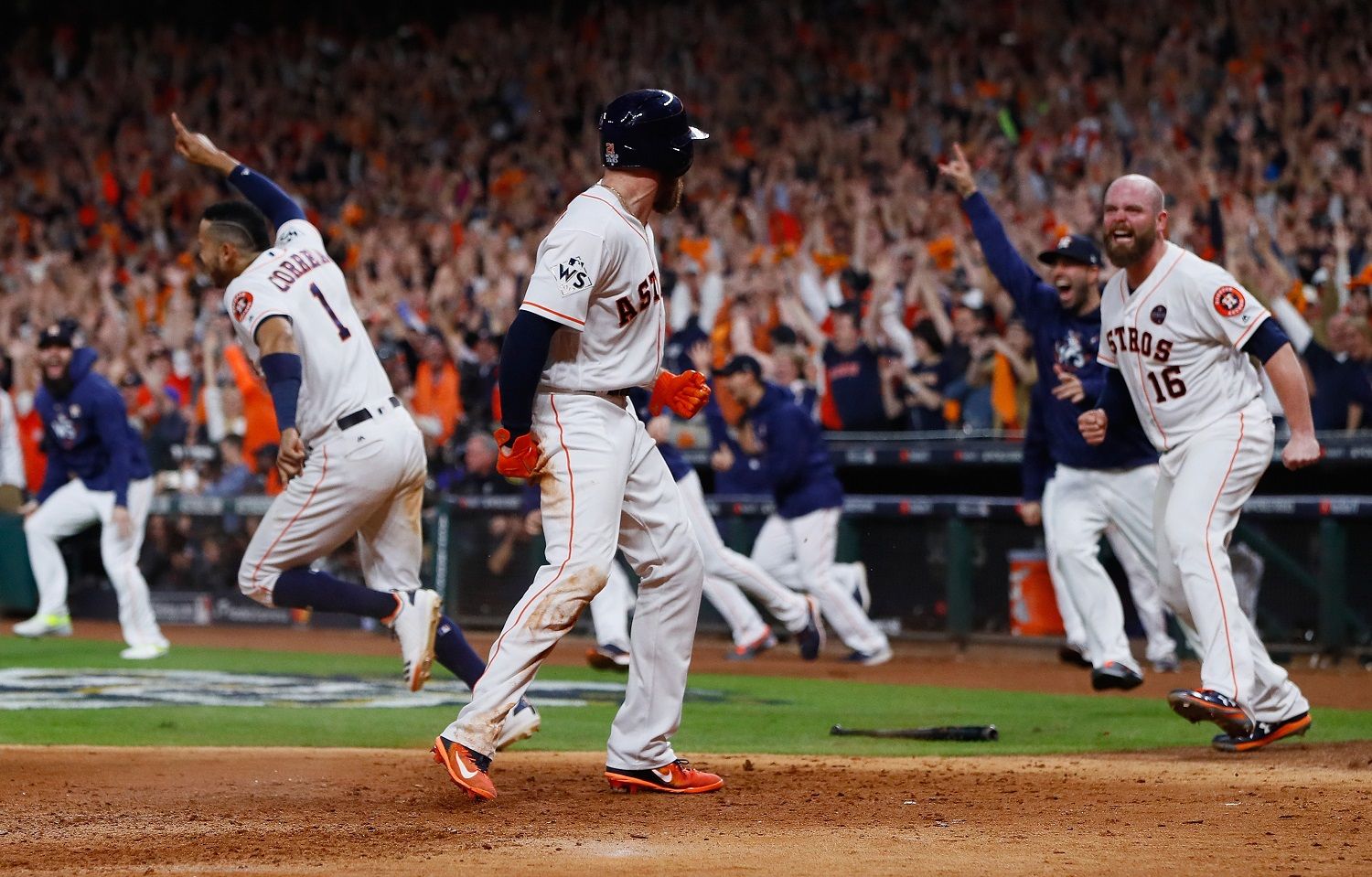 HOUSTON, TX - OCTOBER 30:  Derek Fisher #21 of the Houston Astros celebrates with Brian McCann #16 after scoring the winning run during the tenth inning against the Los Angeles Dodgers in game five of the 2017 World Series at Minute Maid Park on October 30, 2017 in Houston, Texas.  (Photo by Jamie Squire/Getty Images)