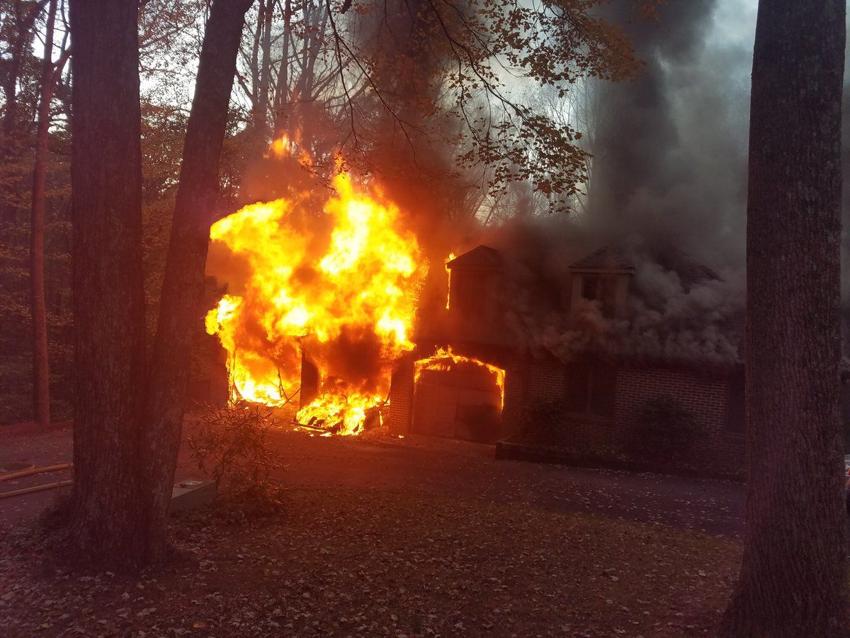 Two people were injured when heavy flames engulfed a large Montgomery County house Thursday evening. (Courtesy Montgomery County Fire & EMS/Pete Piringer)