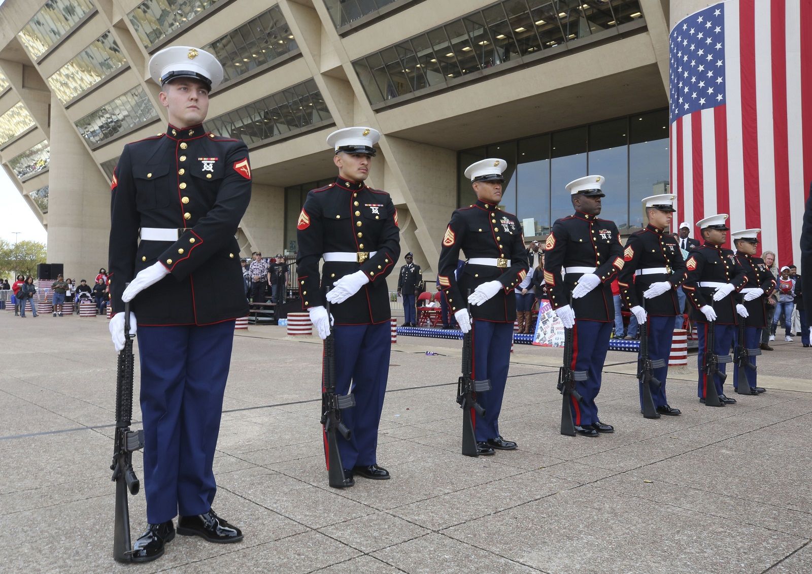 U.S. Marines stand at attention before a Veterans Day parade in Dallas, Friday, Nov. 10, 2017. (AP Photo/LM Otero)