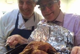 Todd Nash, of Bethesda, shows off his bird, deep fried by Medium Rare co-owner Mark Bucher, on a previous Thanksgiving Day. (Courtesy Mark Bucher)