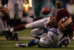 DALLAS - SEPTEMBER 17: Running back Julius Jones #21 of the Dallas Cowboys has the ball stripped by Sean Taylor #21 of the Washington Redskins on September 17, 2006 at Texas Stadium in Dallas, Texas. (Photo by Ronald Martinez/Getty Images)