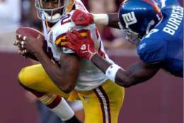 LANDOVER, MD - SEPTEMBER 23: Sean Taylor #21 of the Washington Redskins is tackled by Plaxico Burress #17 of the New York Giants after intercepting a pass September 23, 2007 at FedEx Field in Landover, Maryland.  (Photo by Greg Fiume/Getty Images)