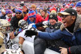 ORCHARD PARK, NY - NOVEMBER 12:  Mark Ingram #22 of the New Orleans Saints jumps into the crowd after scoring a touchdown during the first quarter against the Buffalo Bills on November 12, 2017 at New Era Field in Orchard Park, New York.  (Photo by Brett Carlsen/Getty Images)