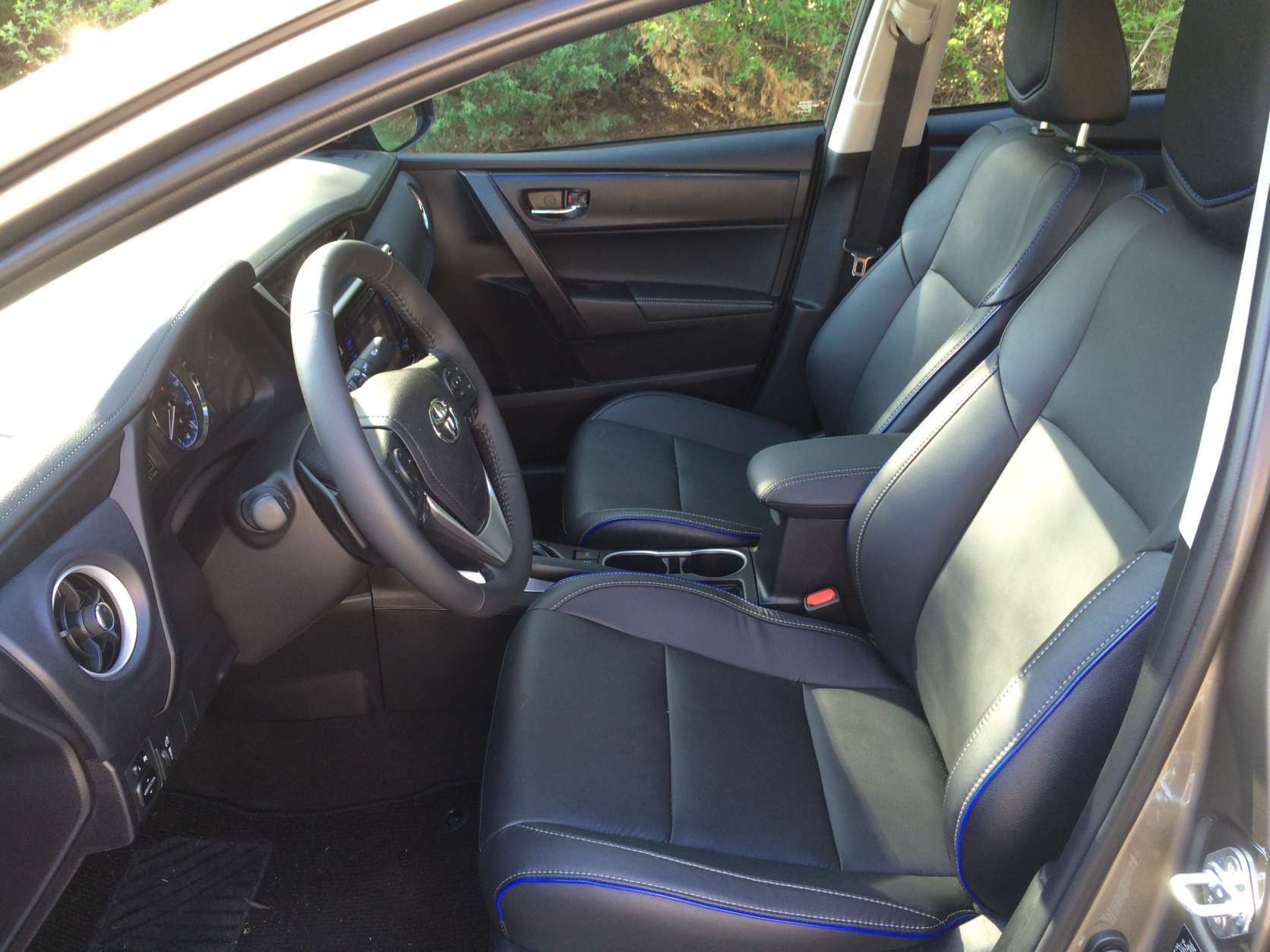 Blue stitching on the seats, dash and door trim pieces add a nice touch. The front seats are heated and the driver’s seat has eight-way power adjustments. (WTOP/Mike Parris) 