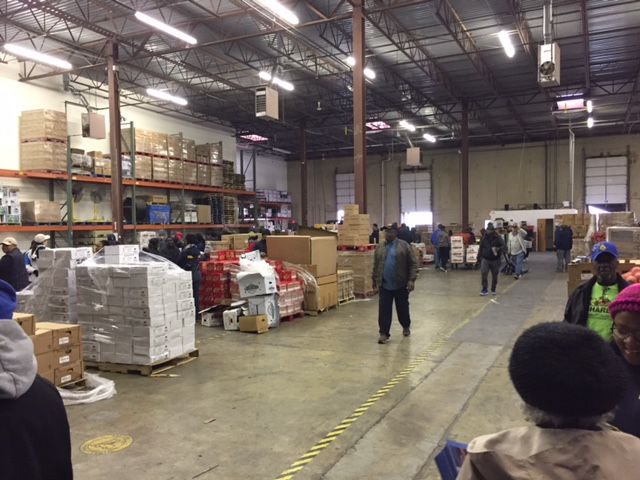 Over 386,000 pounds of food is being distributed to charity organizations, families and businesses that are trying to help make this Thanksgiving affordable for everyone. (WTOP/Dennis Foley)