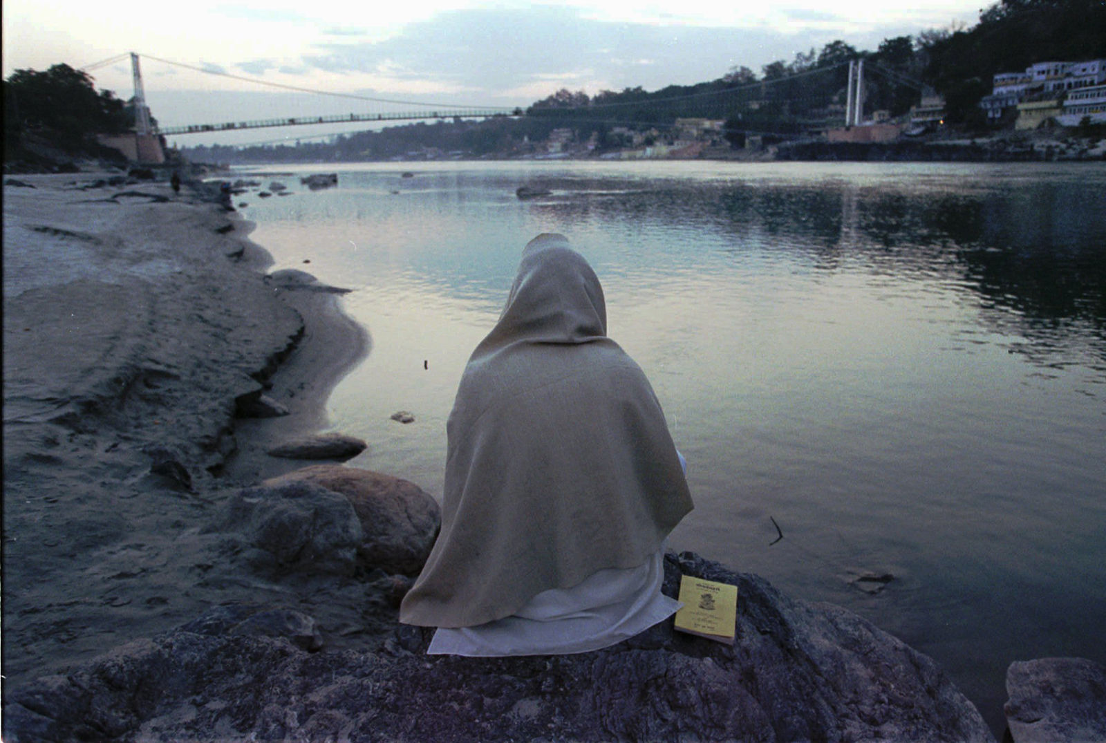 A Hindu pilgrim meditates along the bank of the Ganges River in Rishikesh Monday, January 22, 1996. The town of Rishikesh, located where the Ganges emerges from the foothills of the Himalayas, is considered holy by Hindus and is sometimes refered to as the "Yoga Capital of the World."(AP Photo/John Moore)