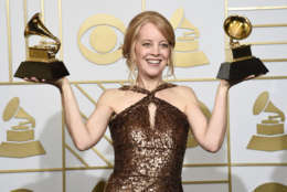 FILE - In this Feb. 15, 2016 file photo, Maria Schneider poses with the award for best arrangement, instruments and vocals for "Sue (Or In A Season Of Crime) " and the award for best large jazz ensemble album for "The Thompson Fields" in the press room at the 58th annual Grammy Awards in Los Angeles. Schneider took home a few 2016 Jazz Awards, one for musician of the year and best album for The Thompson Fields. She also won for composer, arranger and best large ensemble in voting among members of the Jazz Journalists Association. (Photo by Chris Pizzello/Invision/AP, File)