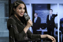 FILE - In this Thursday, March 17, 2016 file photo, actress Meghan Markle participates in AOL's BUILD Speaker Series to discuss her role on the television show, "Suits", in New York. Britain's Prince Harry has condemned racist abuse and harassment of his girlfriend Meghan Markle in the media, issuing a highly unusual statement Tuesday Nov. 8, 2016, that confirmed the relationship and expressed concern for her safety. (Photo by Evan Agostini/Invision/AP, File)