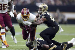 Washington Redskins running back Samaje Perine (32) carries against New Orleans Saints cornerback P.J. Williams (26) in the first half of an NFL football game in New Orleans, Sunday, Nov. 19, 2017. (AP Photo/Rusty Costanza)
