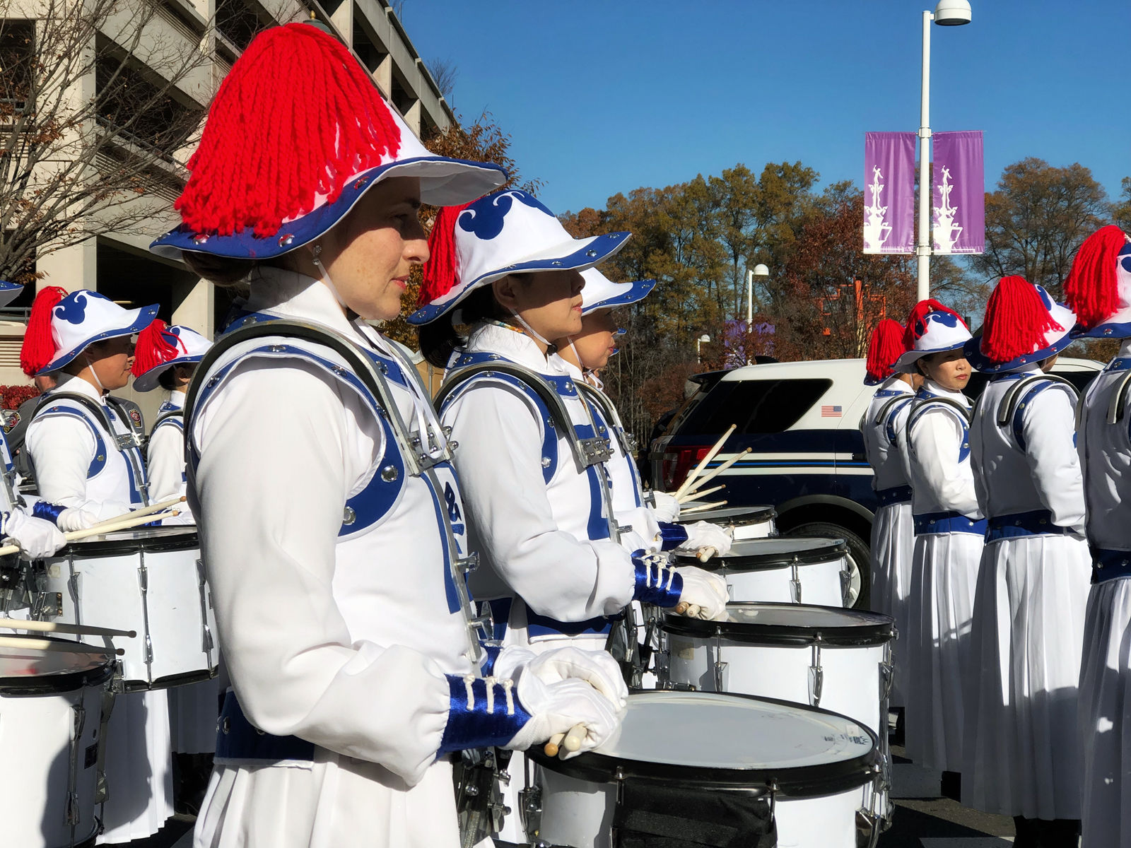 One of the marching bands at the Reston holiday parade gets ready to step off. The annual Reston Holiday Parade took place on Black Friday this year, in the center of the shopping district. (WTOP/Kate Ryan)
