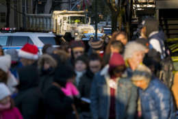 A large truck full of sand blocks a side street as people wait for the start of the Macy's Thanksgiving Day Parade in New York, Thursday, Nov. 23, 2017. (AP Photo/Craig Ruttle)