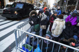 Spectators wait for the start of the Thanksgiving Day parade next to a New York Police Department armored vehicle at 34th Street and 6th Avenue in New York, Thursday, Nov. 23, 2017. (AP Photo/Mary Altaffer)