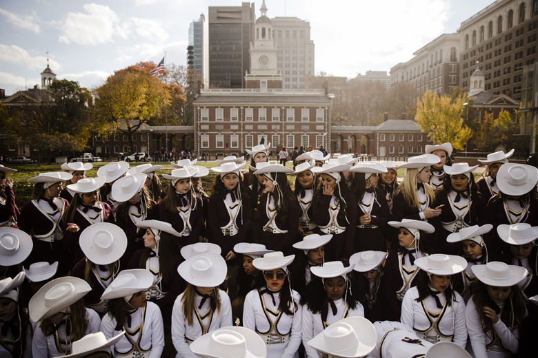 Members of the Texas State University Strutters gather for a photograph in view of Independence Hall in Philadelphia, Wednesday, Nov. 22, 2017. The dance team is in the city to perform in the Thanksgiving Day parade. (AP Photo/Matt Rourke)