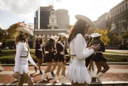 Members of the Texas State University Strutters walk in view of Independence Hall in Philadelphia, Wednesday, Nov. 22, 2017. The dance team is in the city to perform in the Thanksgiving Day parade. (AP Photo/Matt Rourke)
