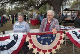 SUTHERLAND SPRINGS, TX - NOVEMBER 11:  Donna King (L) and Beulah Wilson attend a Veterans Day ceremony outside the town's Community Center on November 11, 2017 in Sutherland Springs, Texas. Residents of the community are still trying to heal following the shooting at the First Baptist Church of Sutherland Springs on November 5. Devin Patrick Kelley shot and killed 26 people and wounded 20 others when he opened fire during Sunday service at the church.  (Photo by Scott Olson/Getty Images)