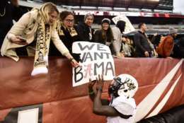 PHILADELPHIA, PA - NOVEMBER 18: Emmanuel Logan-Greene #7 of the UCF Knights touches a fan's sign after the win at Lincoln Financial Field on November 18, 2017 in Philadelphia, Pennsylvania. UCF defeated Temple 45-19. (Photo by Corey Perrine/Getty Images)