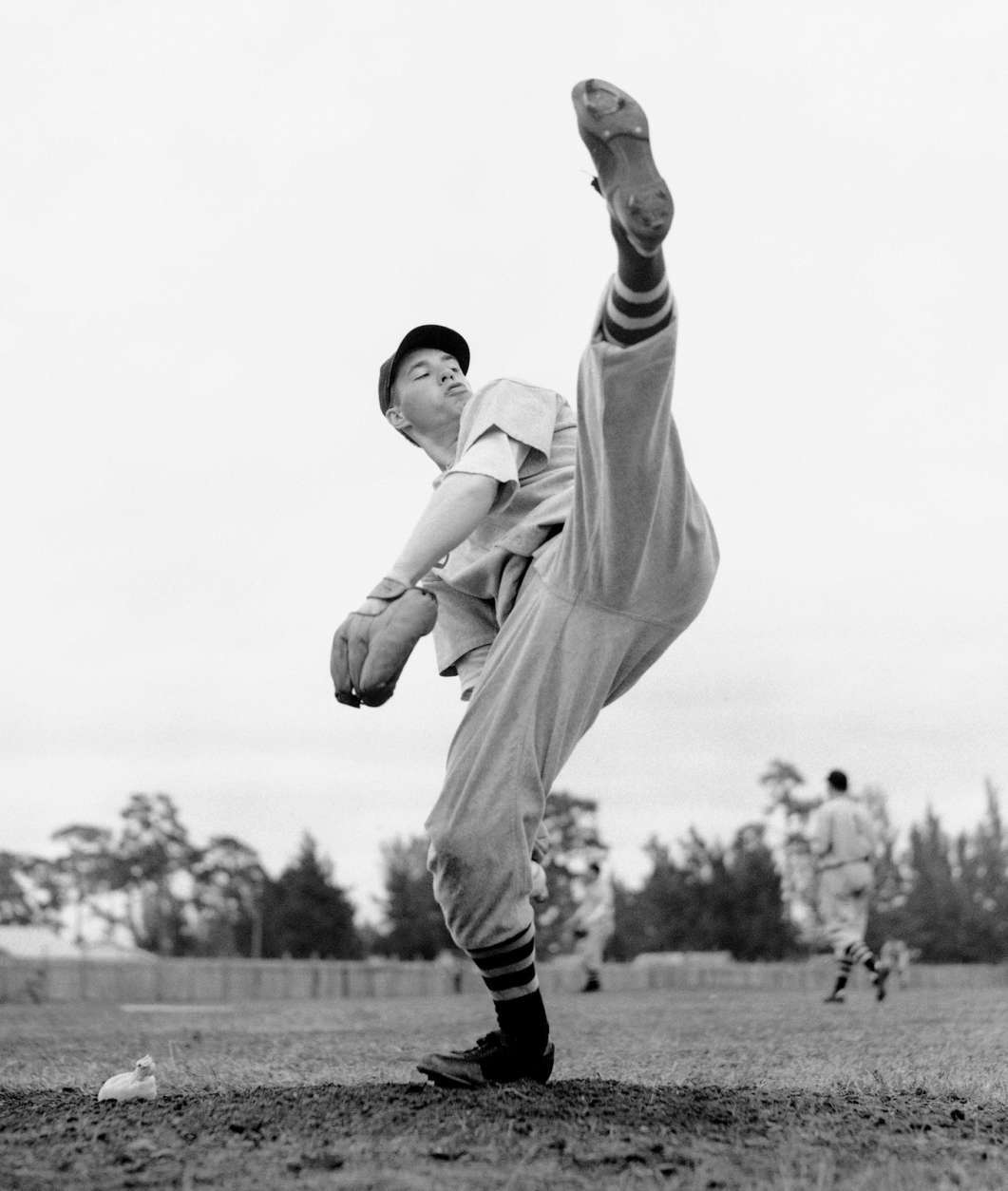 FILE- In this Feb. 28, 1941, file photo, Cleveland Indians star pitcher Bob Feller works on his form during spring training baseball in Fort Myers, Fla. Feller, the Iowa farm boy whose powerful right arm earned him the nickname "Rapid Robert" and made him one of baseball's greatest pitchers during a Hall of Fame career with the Indians, has died Wednesday, Dec. 15, 2010. He was 92.  (AP Photo/File)