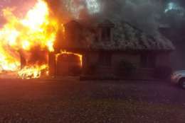 Photo shows flames of a house fire
