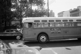 FILE - In this April 26, 1956, file photo, a bus driver is all alone as his empty bus moves through downtown Montgomery, Ala, as a boycott continues even though the bus company has ordered an end to segregation. The 60th anniversary of the Montgomery bus boycott is widely credited with helping spark the modern civil rights movement. (AP Photo/Horace Cort, file)