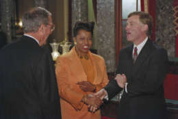 Carol Moseley Braun, D-Illinois, shakes hands with Vice President Dan Quayle after reenacting the taking of the Senate oath on Capitol Hill, January 5, 1993. Senate Majority Leader George Mitchell of Maine, looks on at left. Braun became the first black woman to become a member of the Senate. ( AP Photo/ Ron Edmonds )