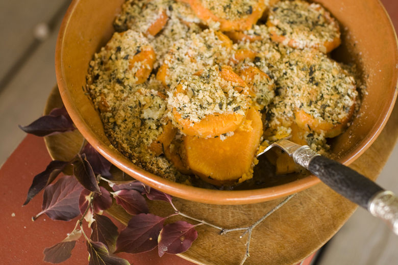 In this image taken on Oct. 8, 2012, herb-crusted sweet mashed potatoes are shown served in a bowl in Concord, N.H. (AP Photo/Matthew Mead)