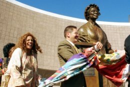 Artist Tina Allen, left, and Michigan State Rep. Mark Schauer, D-Battle Creek, help unveil the Sojourner Truth statue Saturday, Sept. 25, 1999, in Battle Creek, Mich.  The new statue, sculpted by Allen, commemorates Truth more than a century after her lifetime.  She was an early activist for equality and truth.  (AP Photo by Ron Leifeld)
