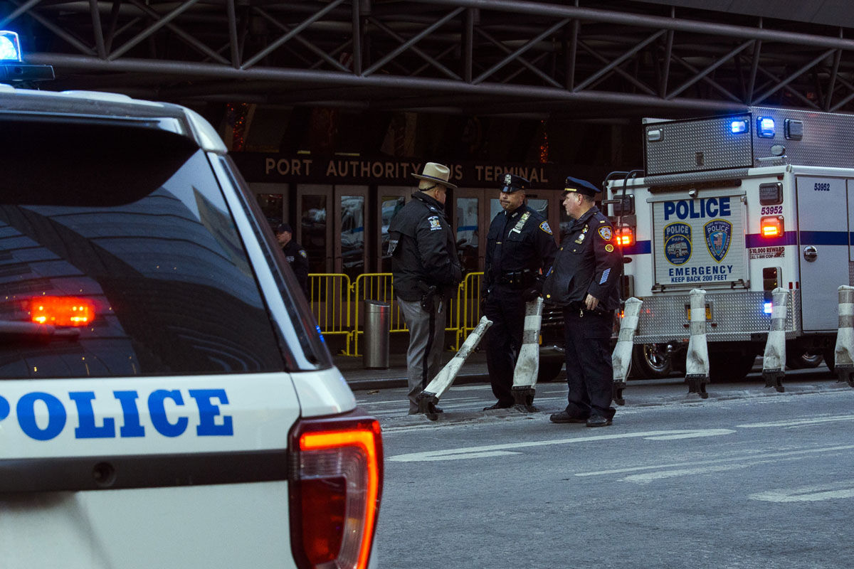 Police stand guard in front of the Port Authority Bus Terminal near New Yorkâ€™s Times Square following an explosion on Monday, Dec. 11, 2017. Police say the explosion happened in an underground passageway under 42nd Street between 7th and 8th Avenues. (AP Photo/Andres Kudacki)
