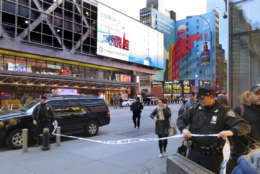 Police secure Eighth Avenue outside the Port Authority Bus Terminal following an explosion near New York's Times Square on Monday, Dec. 11, 2017. Police said a man with a pipe bomb strapped to him set off the crude device in an underground passageway under 42nd Street between Seventh and Eighth Avenues. (AP Photo/Chuck Zoeller)