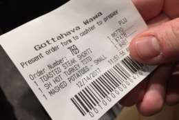 A ticket to order and collect your grub at the new Wawa. (WTOP/Kristi King)