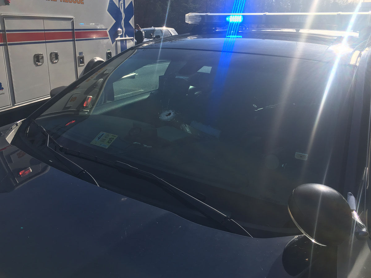 Authorities said the SUV driver fired shots at both a Virginia State Trooper and a Stafford County Sheriff's deputy. The gunman's bullets struck and penetrated the windshields of both vehicles, authorities said. This photo shows the trooper's vehicle with the bullet hole. (Courtesy Virginia State Police)
