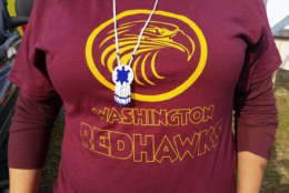  They were also handing out shirts at the rally that had the Redskins's logo and the name the Redhawks on them. (WTOP/Kathy Stewart)
