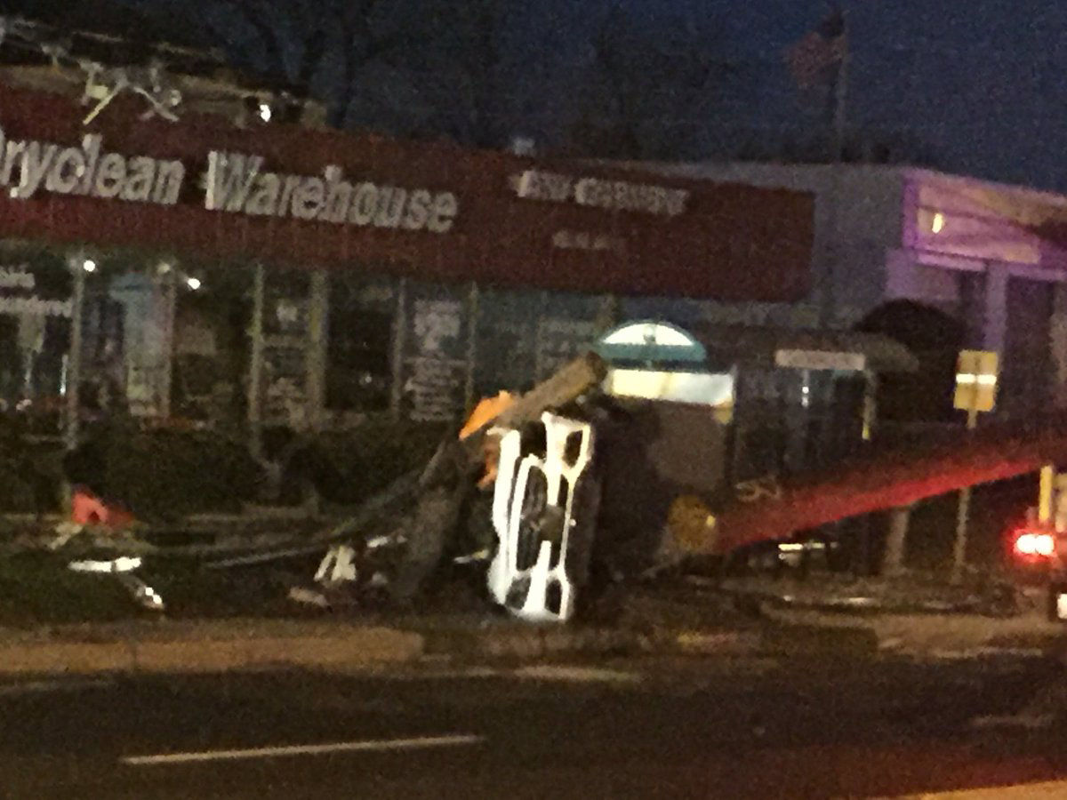 An overturned Mercedes on MD-355 that crashed into a pole and knocked wires down onto the street at around 12:30 a.m. on Friday. (WTOP/John Domen)