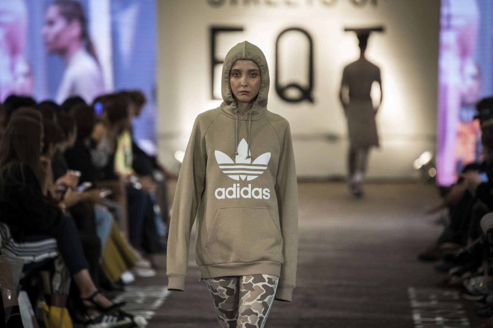 A model wears a creation from the collection Adidas x JD Sports 'Streets of EQT' Spring/Summer 2018 during their runway show at London Fashion Week in London, Friday, Sept. 15, 2017.(Photo by Vianney Le Caer/Invision/AP)