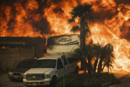 Flames consume a home on Via Arroyo as a wildfire rages in Ventura, Calif., on Tuesday, Dec. 5, 2017. (AP Photo/Noah Berger)