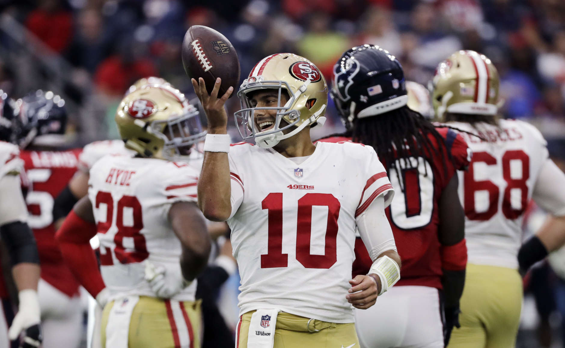 San Francisco 49ers quarterback Jimmy Garoppolo (10) smiles after a play during the second half of an NFL football game against the Houston Texans, Sunday, Dec. 10, 2017, in Houston. San Francisco won 26-16. (AP Photo/David J. Phillip)