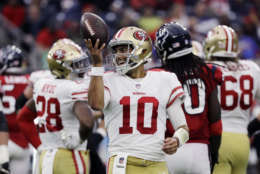 San Francisco 49ers quarterback Jimmy Garoppolo (10) smiles after a play during the second half of an NFL football game against the Houston Texans, Sunday, Dec. 10, 2017, in Houston. San Francisco won 26-16. (AP Photo/David J. Phillip)