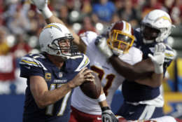 Los Angeles Chargers quarterback Philip Rivers scrambles during the first half of an NFL football game against the Washington Redskins, Sunday, Dec. 10, 2017, in Carson, Calif. (AP Photo/Alex Gallardo)