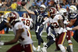 Los Angeles Chargers quarterback Philip Rivers throws a pass during the first half of an NFL football game against the Washington Redskins, Sunday, Dec. 10, 2017, in Carson, Calif. (AP Photo/Alex Gallardo)