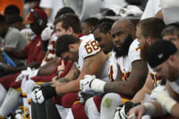 Washington Redskins guard Tyler Catalina (68) reacts as he sits with teammates during the second half of an NFL football game against the Los Angeles Chargers, Sunday, Dec. 10, 2017, in Carson, Calif. (AP Photo/Denis Poroy)