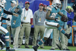 Miami Dolphins cornerback Xavien Howard (25) celebrates an interception, during the first half of an NFL football game against the New England Patriots, Monday, Dec. 11, 2017, in Miami Gardens, Fla. (AP Photo/Lynne Sladky)