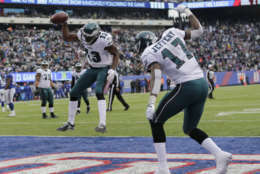 Philadelphia Eagles wide receiver Nelson Agholor (13) and wide receiver Alshon Jeffery (17) celebrate after Agholor caught a touchdown pass from quarterback Nick Foles, not pictured, during the second half of an NFL football game against the New York Giants, Sunday, Dec. 17, 2017, in East Rutherford, N.J. (AP Photo/Seth Wenig)