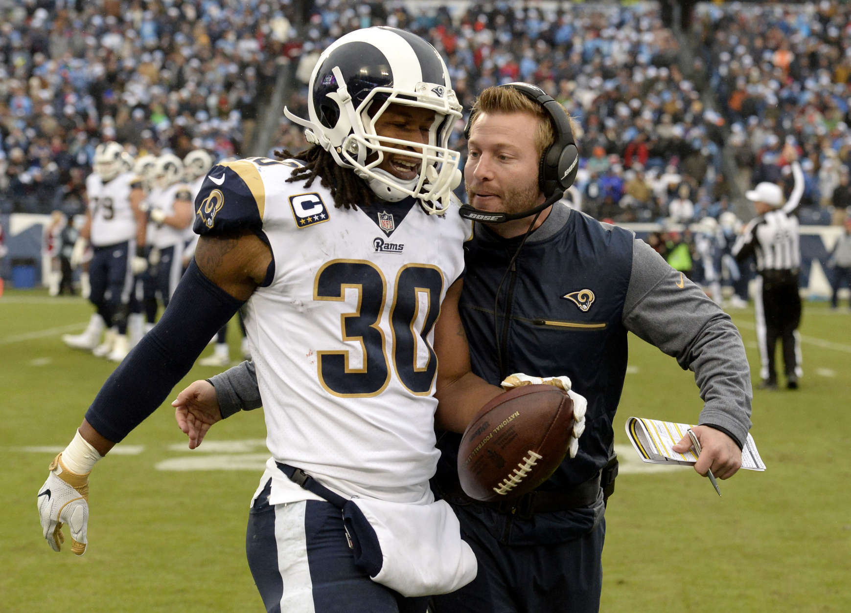Los Angeles Rams running back Todd Gurley (30) is congratulated by head coach Sean McVay after Gurley scored a touchdown against the Tennessee Titans on an 80-yard pass reception in the first half of an NFL football game Sunday, Dec. 24, 2017, in Nashville, Tenn. (AP Photo/Mark Zaleski)