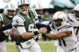 New York Jets quarterback Bryce Petty (9) tosses the ball away from Los Angeles Chargers' Adrian Phillips (31) during the second half of an NFL football game Sunday, Dec. 24, 2017, in East Rutherford, N.J. (AP Photo/Seth Wenig)
