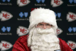 Kansas City Chiefs head coach Andy Reid wears a Santa costume during a news conference following an NFL football game against the Miami Dolphins in Kansas City, Mo., Sunday, Dec. 24, 2017. The Kansas City Chiefs won 29-13. (AP Photo/Orlin Wagner)