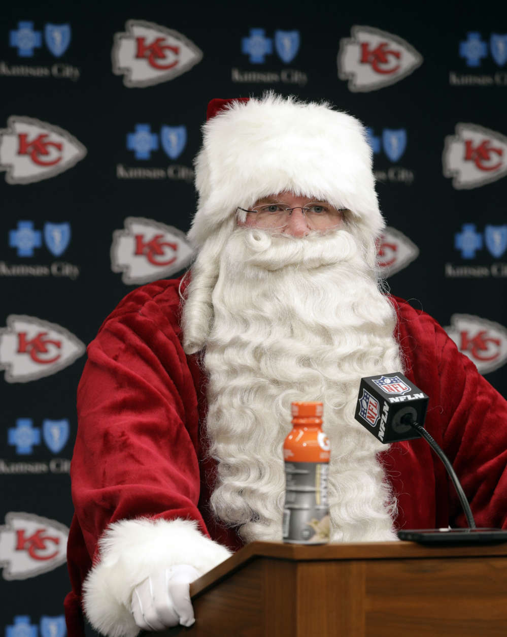 Kansas City Chiefs head coach Andy Reid wears a Santa costume during a news conference following an NFL football game against the Miami Dolphins in Kansas City, Mo., Sunday, Dec. 24, 2017. The Kansas City Chiefs won 29-13. (AP Photo/Orlin Wagner)