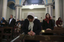 Iranian Christian worshippers attend the Christmas mass at the Saint Joseph Chaldean-Assyrian Catholic church, in Tehran, Iran, Monday, Dec. 25, 2017. Iranian Christians are a minority and recognized by the constitution in the Muslim country and are represented in the parliament. (AP Photo/Vahid Salemi)