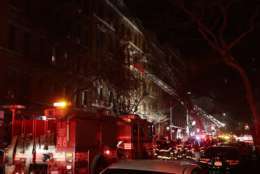 Firefighters respond to a building fire Thursday, Dec. 28, 2017, in the Bronx borough of New York. The Fire Department of New York says a blaze raging in a Bronx apartment building has seriously injured more than a dozen of people. (AP Photo/Frank Franklin II)