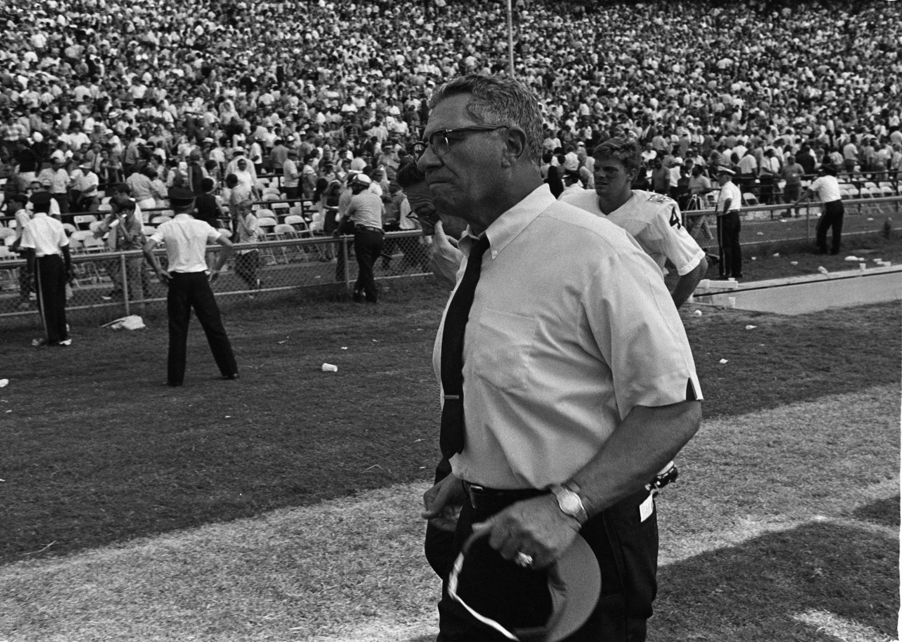 Washington Redskins head coach Vince Lombardi voices his opinion about a play from the sidelines where he made his regular season debut with the team in New Orleans, La., Sept. 21, 1969. Lombardi's expression later changed to a smile as the Redskins beat the New Orleans Saints 26-20. (AP Photo)