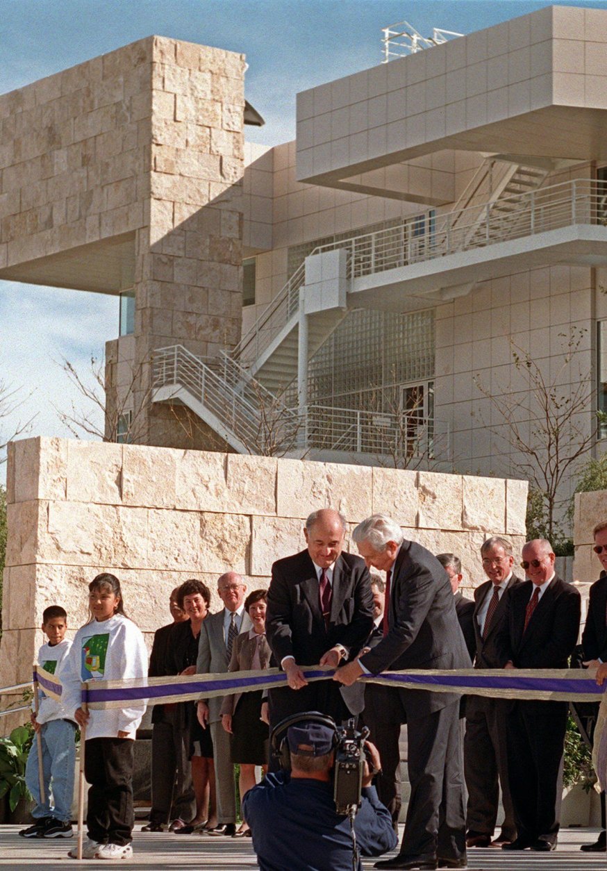 Robert E. Erburu, chairman of the board of J. Paul Getty Trust, left, and Harold M. Williams, president and CEO of J. Paul Getty Trust, cut the ribbon to commemorate the opening of the Getty Center on  Saturday, Dec. 13, 1997, in Los Angeles. Planned, designed and constructed over 13 years, the Getty Center's 24-acre campus on 110-acre site is both a museum and arts complex. The $1 billion hilltop monument to art and architecture is set to open to the public on Tuesday. (AP Photo/Mark J. Terrill)